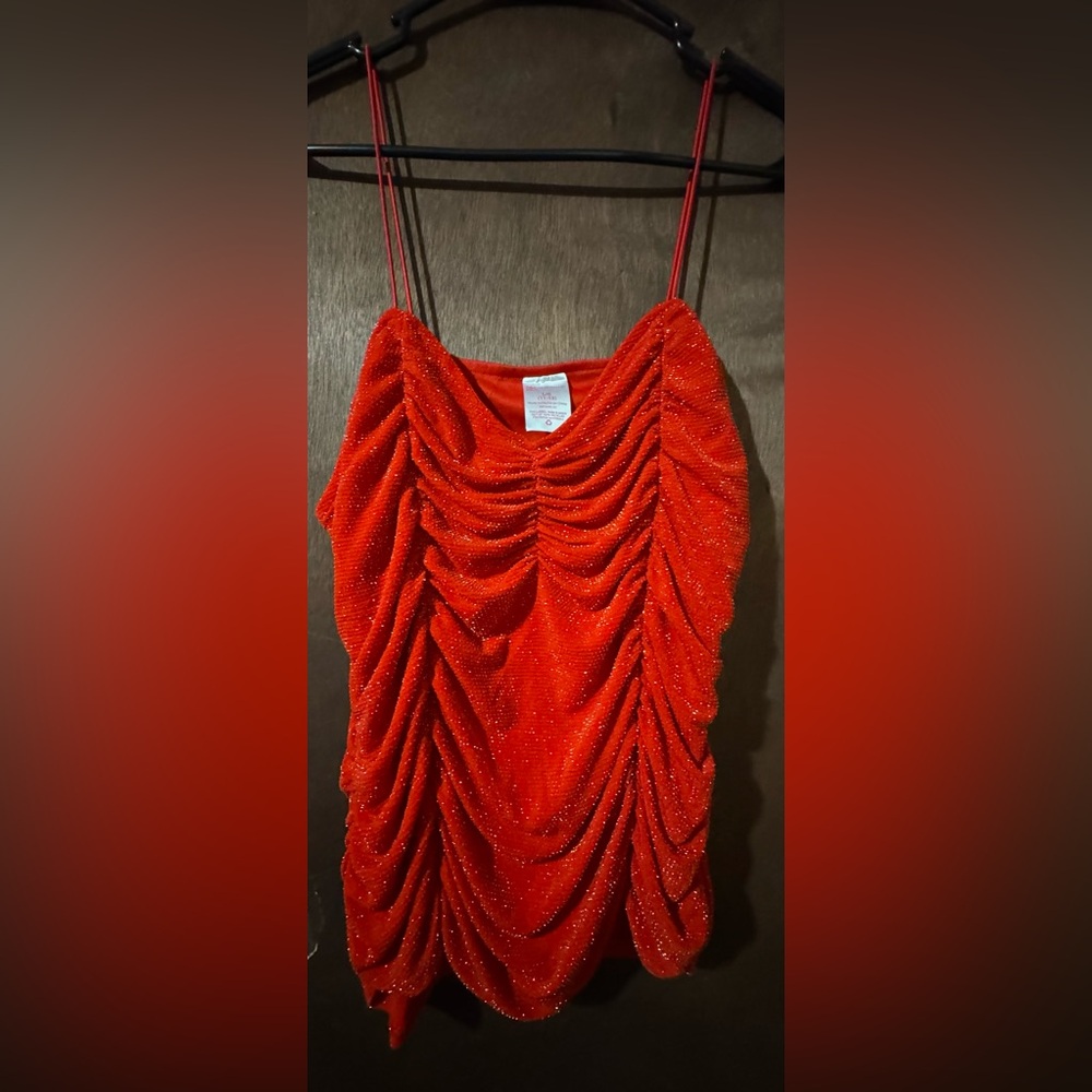 5/$15.00or $5 alone bundle item.Women’s L Rutched Red Sparkly cute top
